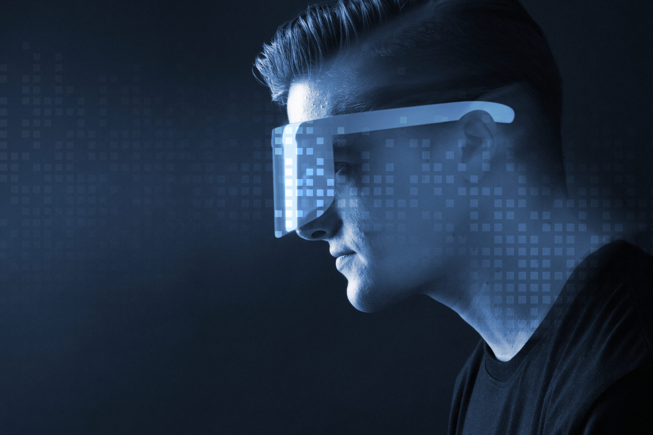 Man in glasses augmented reality blue